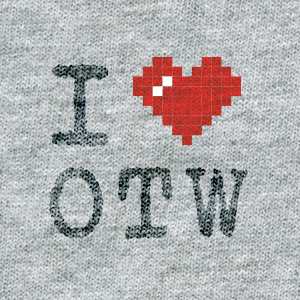 ASCII style image of a red heart on a grey t-shirt background, reading: I heart OTW.